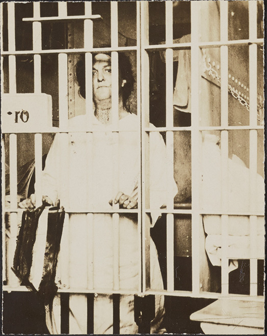 Suffragist Helena Hill looks out from her cell